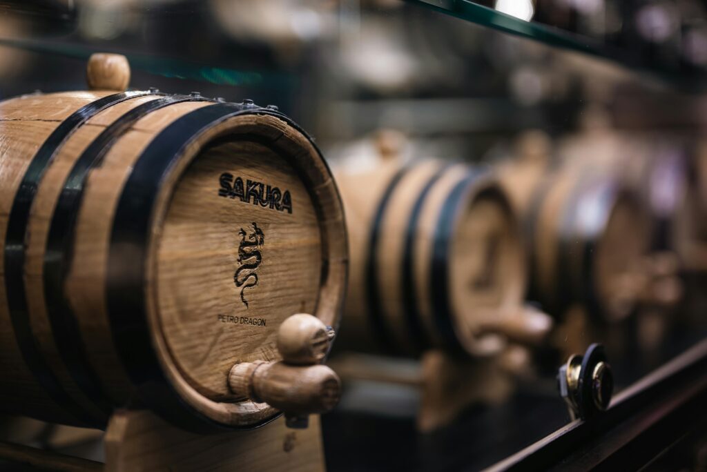 Detailed view of aging barrels in a distillery, showcasing wine production process.